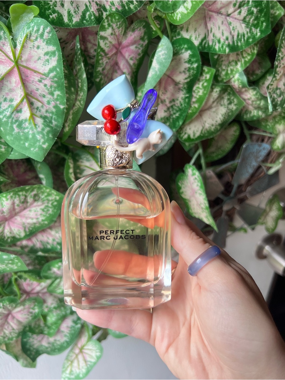 Marc Jacobs Perfect Eau de Parfum bottle featuring signature whimsical charm cap